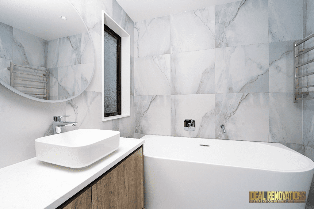 modern and stylish bathroom renovation used tiles with a white marble design
